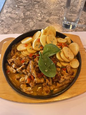 Their vegan 'pan' - nomeat chunks in curry sauce with potatoes. Great portion size and delicious.  at Qulto - Slovenska in Maribor