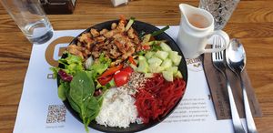 Veganiqa Buddha bowl with fake chicken pieces and vegan dressing at Qulto - Slovenska in Maribor
