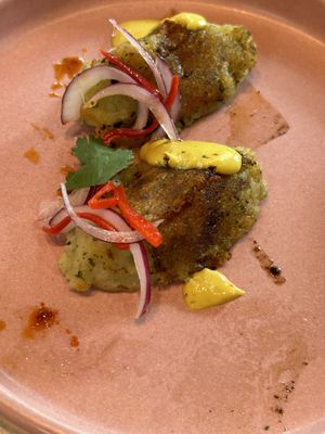 Oops, we ate the skewers that rested on these puffs  at Mudra in Buenos Aires