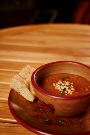 Sopa de Mani Africano. Base de tomate, mani, jengibre fresco, servido con pan de eleccion (focaccia, masa madre o multigrano).                       Una entrada perfecta:)
 at Gaia Forest Cafe & Market in Granada