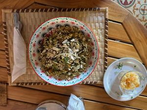 Ensalada Tucán, pasta al pesto con Zucchini, ayote y almendras, acompañado con chucrut at Gaia Forest Cafe & Market in Granada