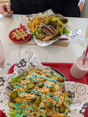 Krusty burger on fries and Ke'barb on hotdog and fries at Feed Me Fully Loaded in Nottingham