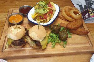 Afternoon tea: CHEESEBURGER
SLIDERS plant-based burger, vegan cheese, lettuce, Rev's Relish. Onion rings. Vegan Nachos. CRISPY FRIED CHICKEN
Plant-based chicken, with sriracha mayo at Revolution in Wilmslow