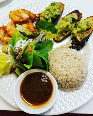 sea crescents, brown rice, eggplant with guac and a salad.  at Loving Hut - Cape Coral in Cape Coral