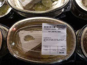 Raw vegan key lime pie sold in refrigerated case to the right of raw vegan cuisine counter/cafe. at Seed to Table Market in Naples