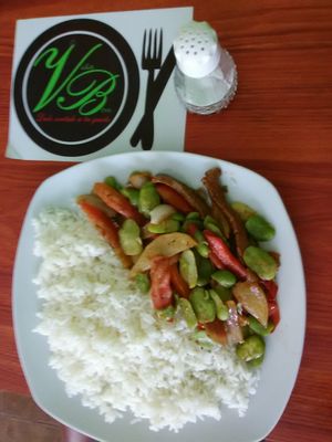 Main plate: white rice, mixture of Lima beans, tomatoes, onions, potatoes, and mock meat at Vida Bon in Cajamarca