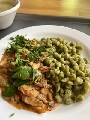 Spinach halusky with mushrooms in a sauce at Vegan Om in Bratislava
