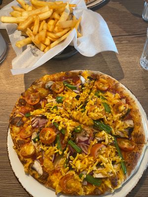 Vegan pizza and chips. at Papa's in Grindavik