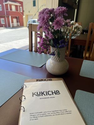 Fresh flowers and and easy to read menu  at Kukicha in Leiria