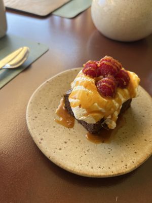 Brownie with chantilly cream, fresh raspberries and salted caramel. Excellent !  at Kukicha in Leiria
