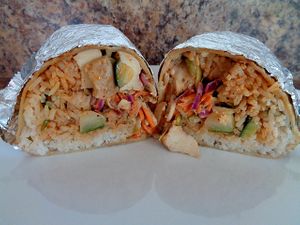 Bangkok w/ tofu. Asian cabbage, cilantro lime rice, cucumber, shredded carrots, slivered almonds, Thai-style peanut sauce, spicy cashew vinaigrette, sesame seeds  at CLE - Currito - Main Terminal in Cleveland