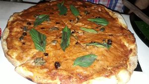 Pizza with capers and chillis at Locco's Pizza Bar in Koh Phangan