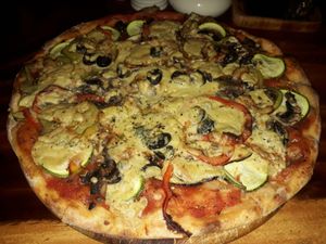 Pizza with hummus and veggies at Locco's Pizza Bar in Koh Phangan
