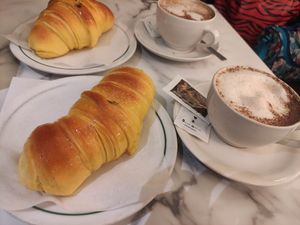 brioche croissants with capuccino at Pastelaria Tupi in Porto
