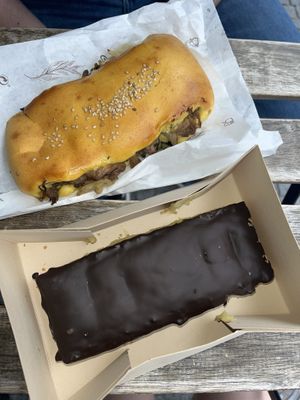 Chocolate-coated pastry with a curd on the outside and a mushroom slice  at Pastelaria Tupi in Porto