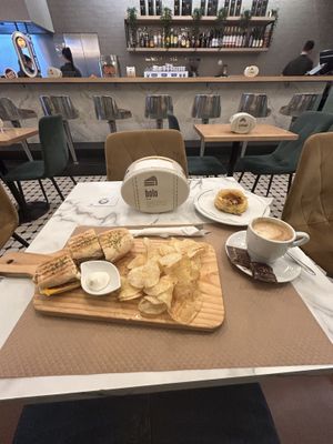 Vegan hot dog, pastry and latte with oat milk  at Pastelaria Tupi in Porto