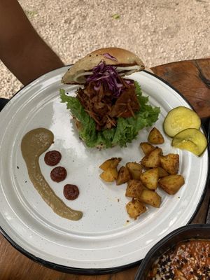 Jackfruit burger with pickles on the side  at Liefs in Tulum