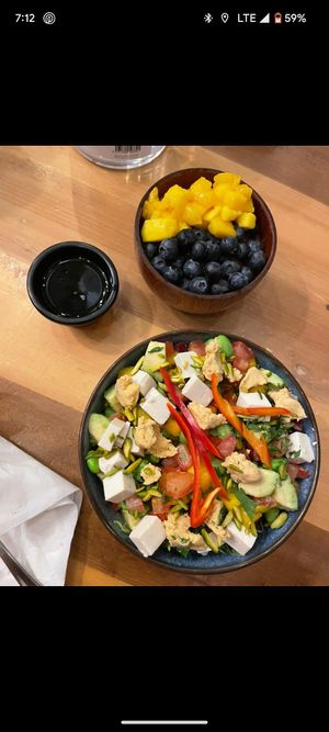 Vegan power bowl with chickpea puree, tofu, avocados, roasted potatoes, edamame, lettuce and tomatoes. at Projeto Acai in Dubai