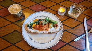 Kimchi toast breakfast with coffee and water. That's a table it's served on, not the floor. at Farm2Table - Davidshall in Malmo