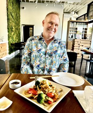 Handsome guy eating   at Love Organic Cafe in West Hollywood