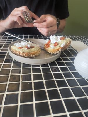 Everything bagel with vegan feta, jalapeño hummus and sun dried tomatoes   at Last Light Coffee in Blackpool