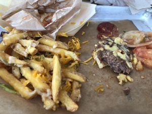 The awful “garlic fries” were just a mess of grease and the burger fell into pieces in my hands.   at Surf Shack in Malmo