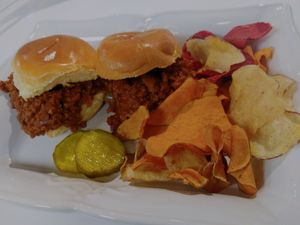 Sloppy joes seved with sweet pickle and veggie chips at Infusedlife Plant Based Emporium in Minneapolis