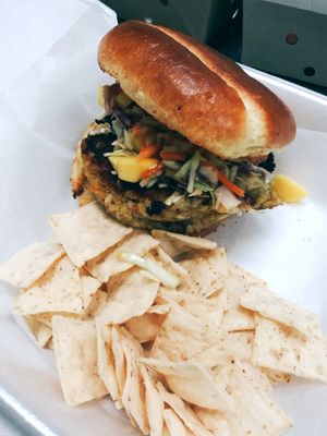 Housemade Vegetarian jerk Burger served with housemade tropical slaw at Infusedlife Plant Based Emporium in Minneapolis