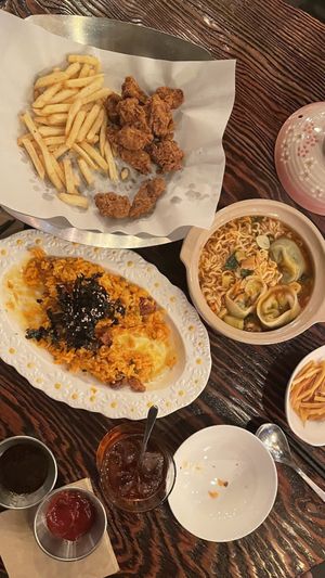 Fried chicken and fries, dumpling ramyun, kimchi fried rice with vegan meat and a negroni  at Mr. Lee in Seoul