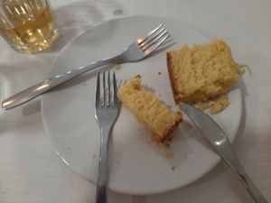 Half-eaten orange cake at Shanti in Braga