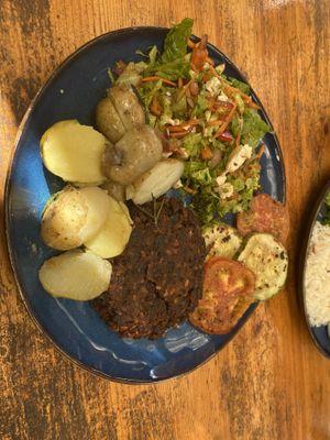 Vegan mixto—black bean burger, salad, grilled veggies, and rosemary potatoes   at Cafe Europa in Liberia