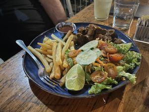 Curry wurst with vegan sausage substituted  at Cafe Europa in Liberia