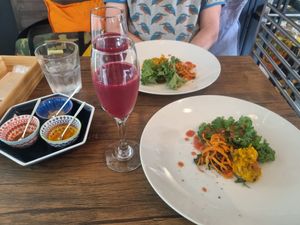 Appetizer for the curry. Made from kale, pumkin, and carrot with extra spices on the side. Plus  beetroot juice. at Seneca in Wakayama