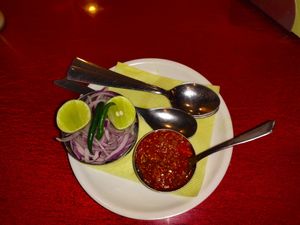 Complementary salad and pickle. at Parivar Restaurant in Gangtok