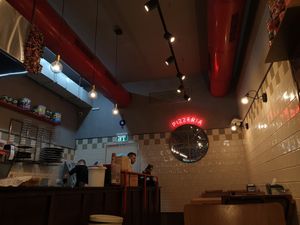 Indoor sitting area at Moto La Pizza in Ramat Gan