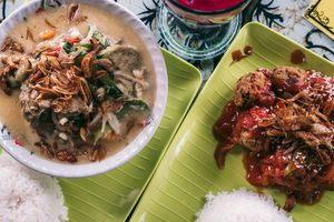 Coconut curry and "tofu steak" which was more like vegan meatballs. Both dishes were very tasty. at Buddha Cafe in Samosir