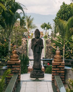 The buddha garden and lake views. at Buddha Cafe in Samosir