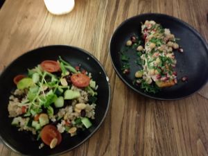 Couscous salad and a sweet potatoe topped with chickpea and pomegranate seeds at Livingstone in Copenhagen