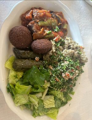 “vegetarian plate” with falafel, moussaka (eggplant), mujadarah, meatless grape leaves, tabbouleh, and dairy free (no feta) salad!   at Albasha Greek & Lebanese - Citiplace Court in Baton Rouge