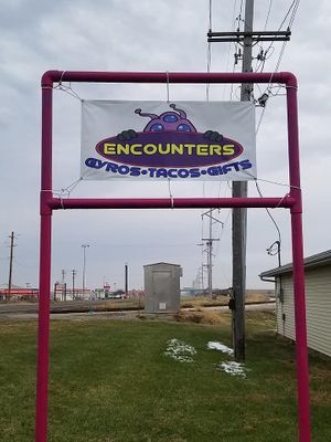 Sign out front  at Encounters in Divernon