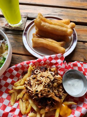 Mushrooms over fries, excellent sauces at Kiez - Vegan Butcher Cafe & Bistro in Hanoi