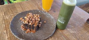 Cauliflower brownie, detox juice at Honest Greens in Lisbon