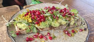 Avocado and pomegranate toast at Honest Greens in Lisbon