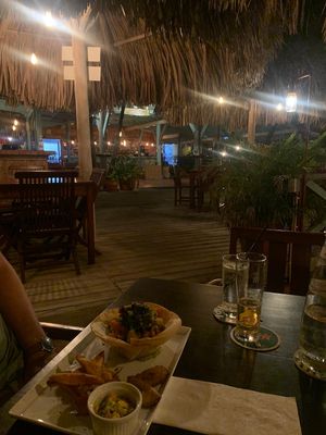 The restaurant. Harbor view with terrace on water on other side. at Tabooshh in Willemstad