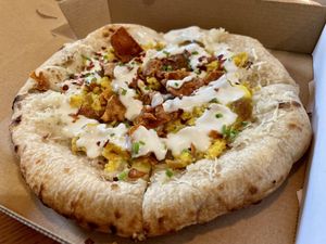 They now have brunch on Sunday 10-1pm. Breakfast Pizza.  at Nom Eats with Seats in Reno
