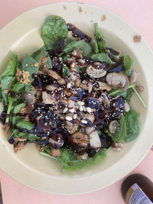 Spinach salad with mushrooms - didn’t like the raisins and dried apricots in it though  at El Cortijo in Zahara De La Sierra