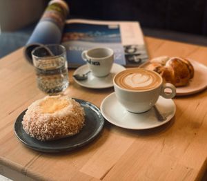 Home made vegan skoleboller with plant milk cappuccino  at Slodko i Czule in Krakow
