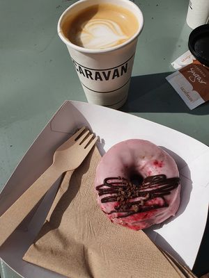 Vegan doughnut and a latte in a sunny day at Steam Yard in Sheffield