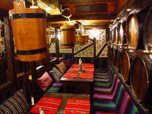 Seats near barrels at Hadjidraganovite Izbi in Sofia