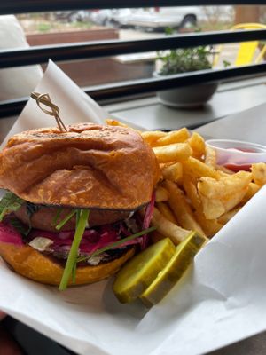 Falafel Burger

house made falafel, pickled red cabbage, fresh herbs, vegan tzatziki, sweet potato bun, served with fries at Chestnut Hill Brewing Company in Philadelphia